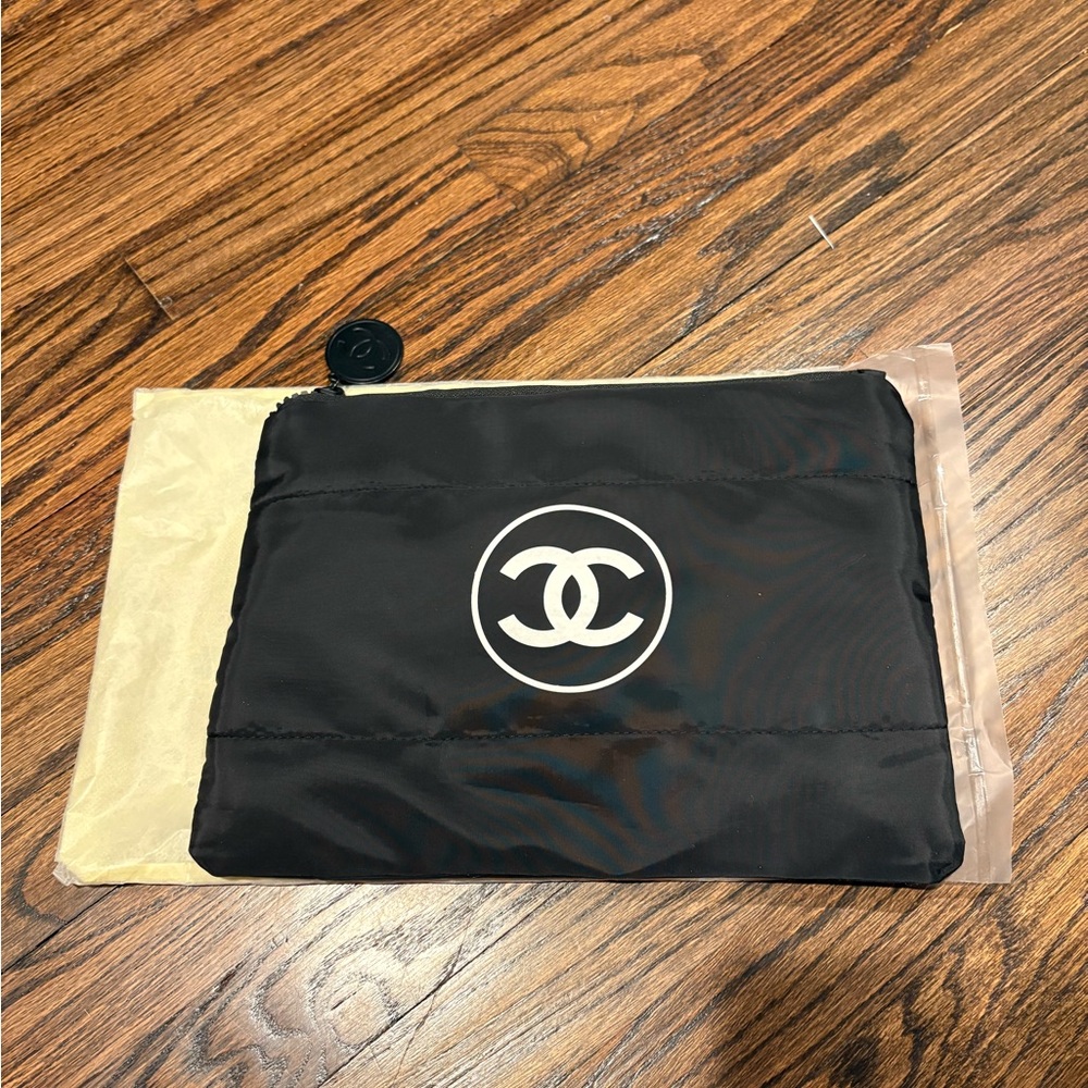 Brand New Chanel Black Zippered Nylon Puffer Pouch with Logo Charm